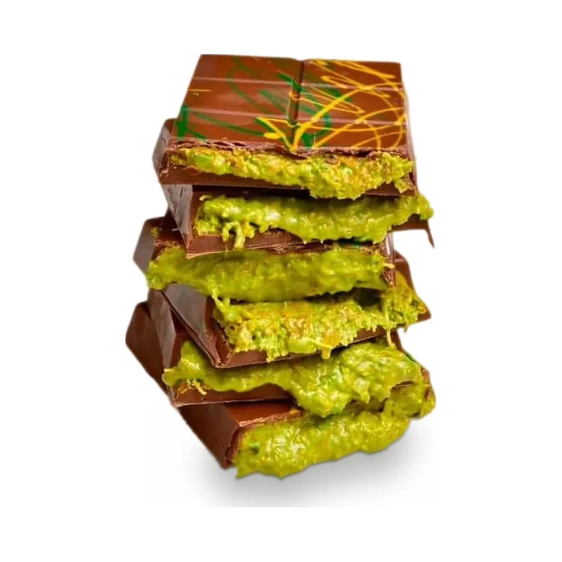 A stack of chocolate squares layered with pistachio