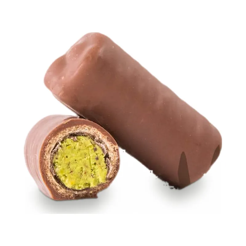 A pink-coated chocolate log cut to show a pistachio centre