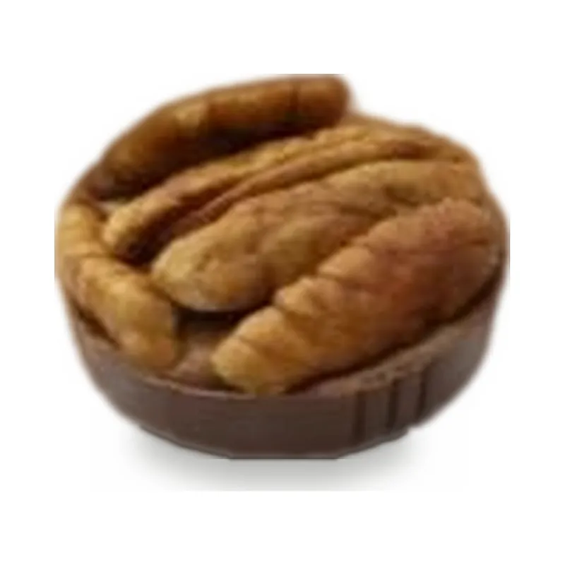 A chocolate cup filled with pecans