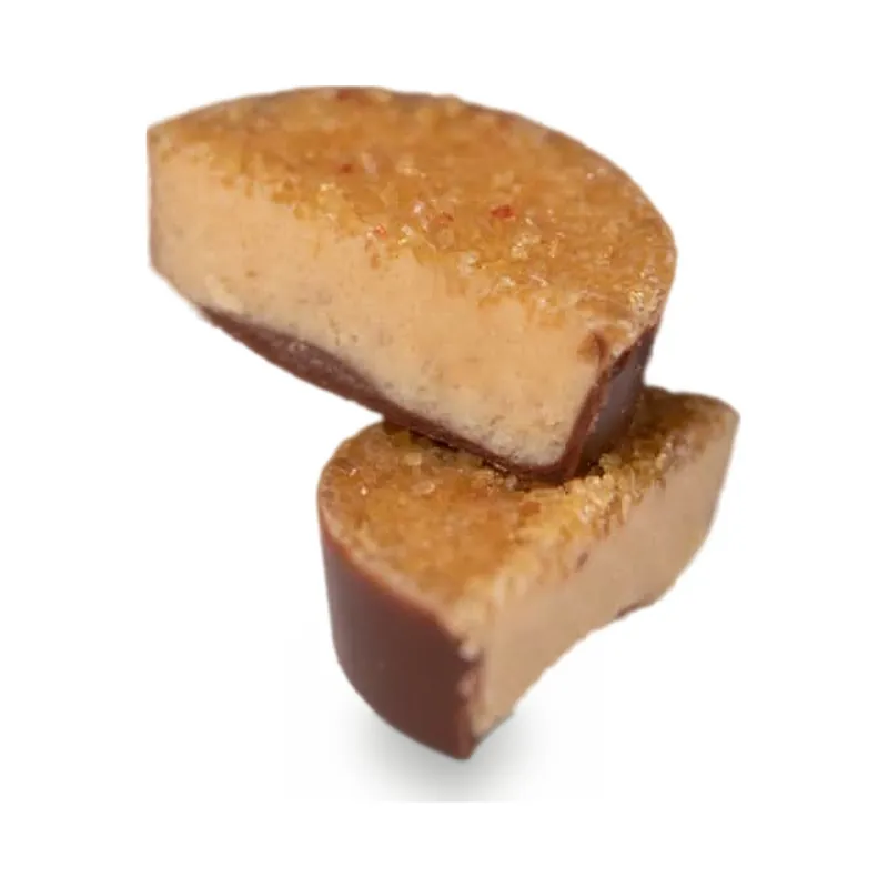 Chocolate cups cut in half to show a caramel filling