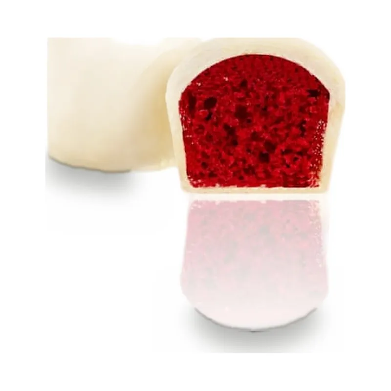 A white chocolate piece cut to show a red centre