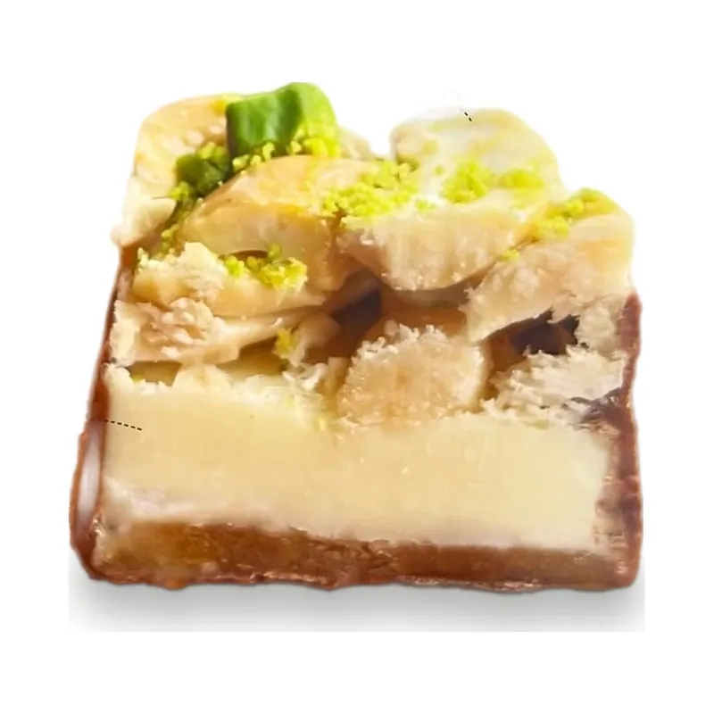A cream and pistachio square on a crisp base
