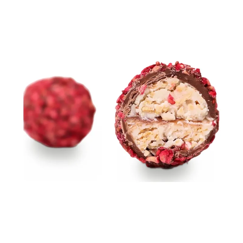 Raspberry-coated truffles, one cut open