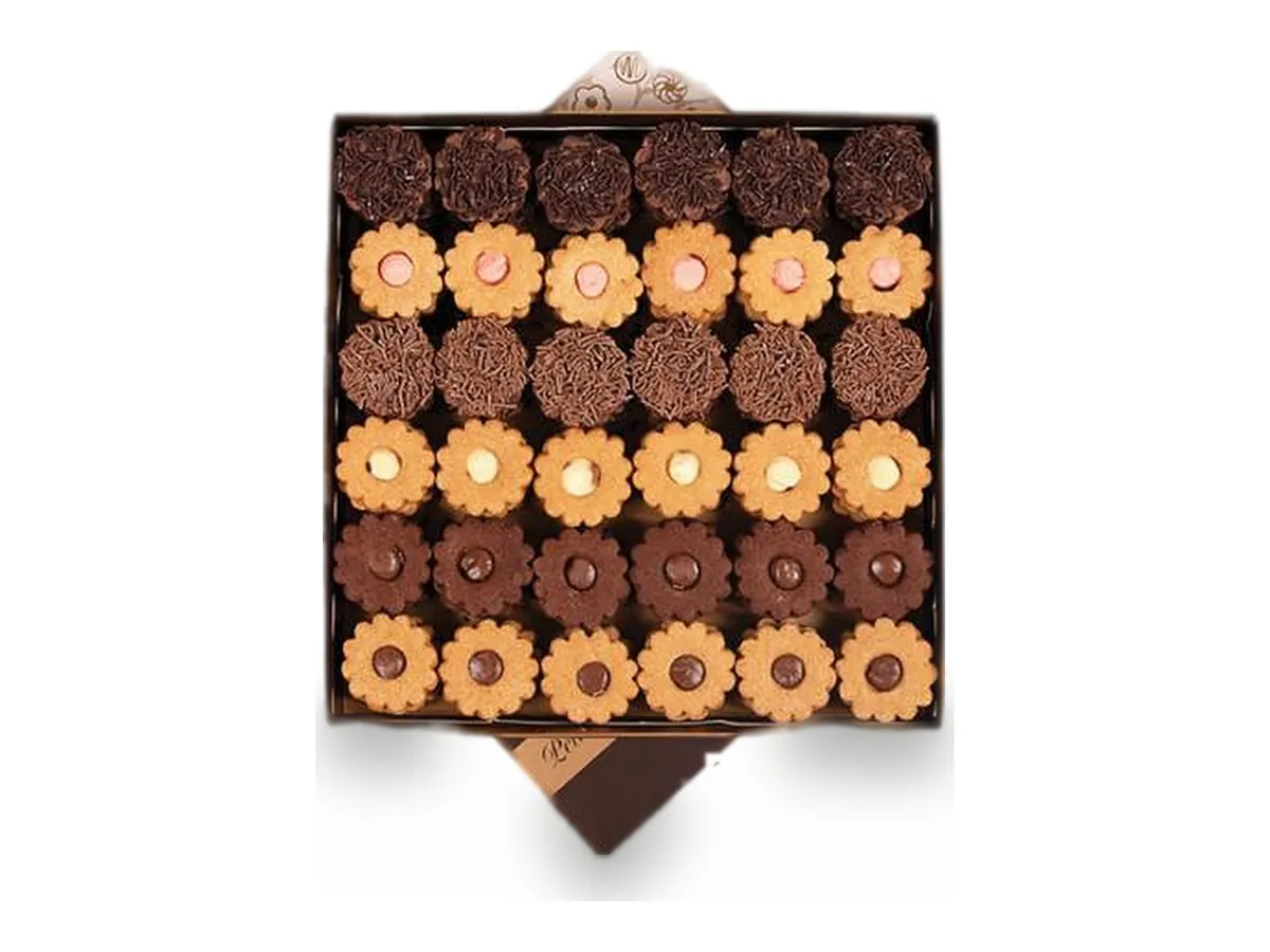 A square box of flower-shaped biscuits and chocolates
