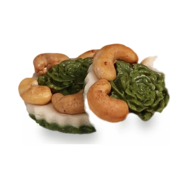 Cashews with green chocolate rosettes