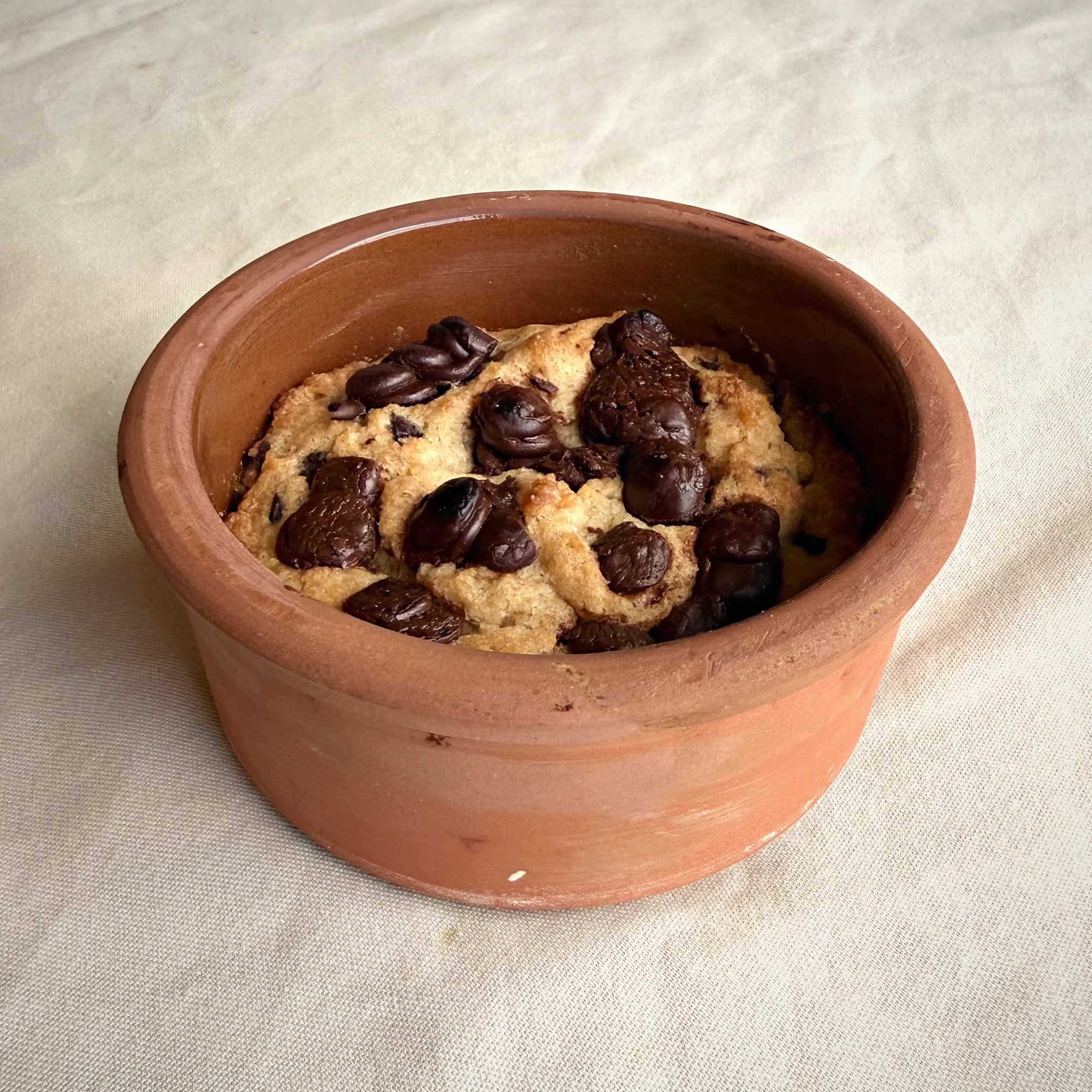 A giant cookie baked in a small pot
